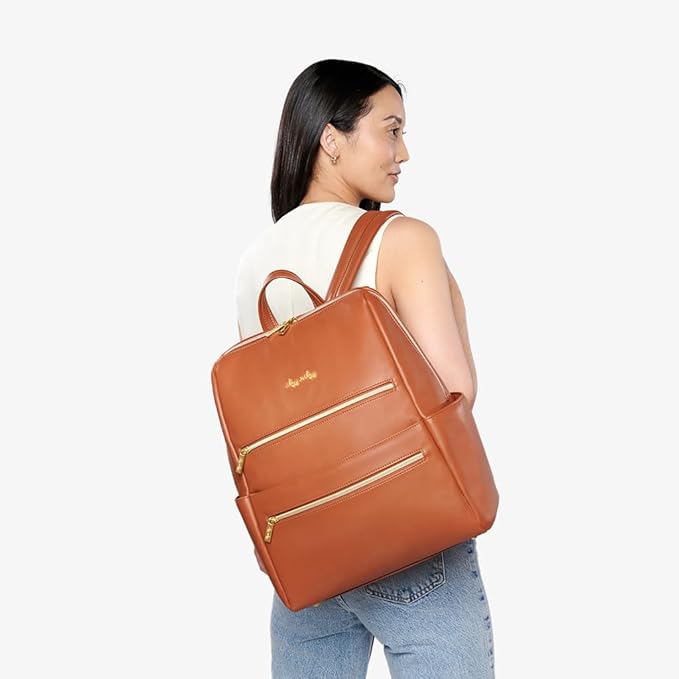 Itzy Ritzy Eras Diaper Bag Backpack – Large Capacity Backpack Diaper Bag Featuring Sleek Design, 15 Pockets, Changing Pad, Stroller Straps, and Luggage Sleeve (Cognac)