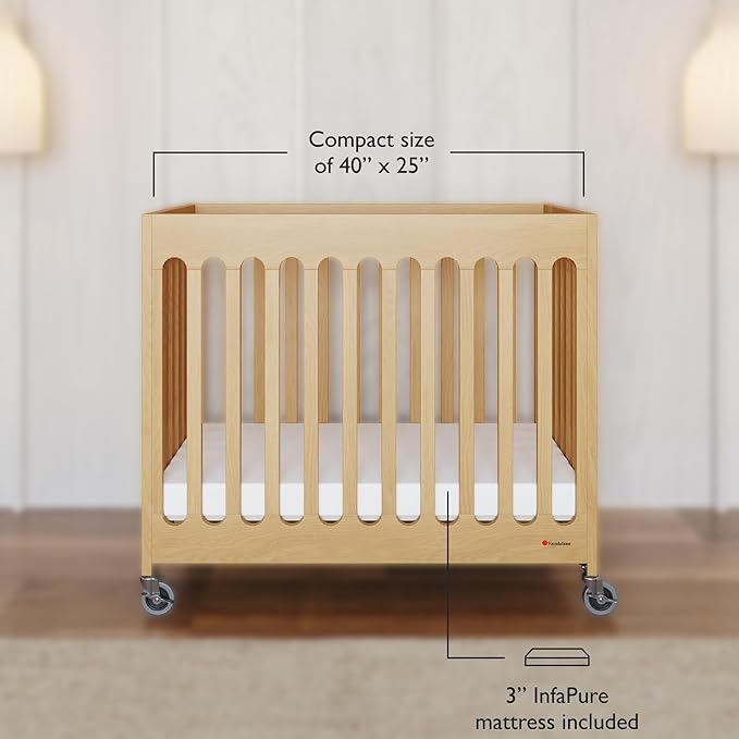 Foundations Boutique Folding Mini Baby Crib - Compact, Portable, Wooden Hotel Crib, Foldable Mini Crib for Baby & Toddlers - Includes 3" Foam Mattress, Natural