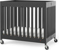 Foundations Boutique Folding Mini Baby Crib - Compact, Portable, Wooden Hotel Crib, Foldable Mini Crib for Baby & Toddlers - Includes 3" Foam Mattress, Ebony