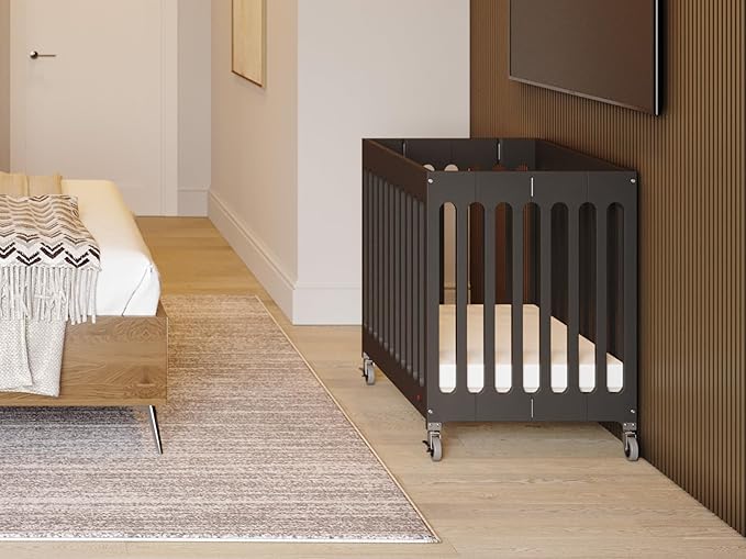 Foundations Boutique Folding Mini Baby Crib - Compact, Portable, Wooden Hotel Crib, Foldable Mini Crib for Baby & Toddlers - Includes 3" Foam Mattress, Ebony