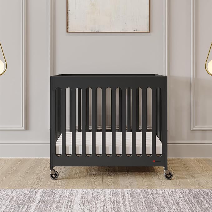 Foundations Boutique Folding Mini Baby Crib - Compact, Portable, Wooden Hotel Crib, Foldable Mini Crib for Baby & Toddlers - Includes 3" Foam Mattress, Ebony