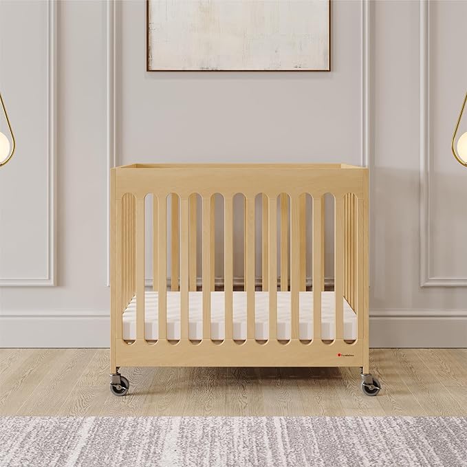 Foundations Boutique Folding Mini Baby Crib - Compact, Portable, Wooden Hotel Crib, Foldable Mini Crib for Baby & Toddlers - Includes 3" Foam Mattress, Natural