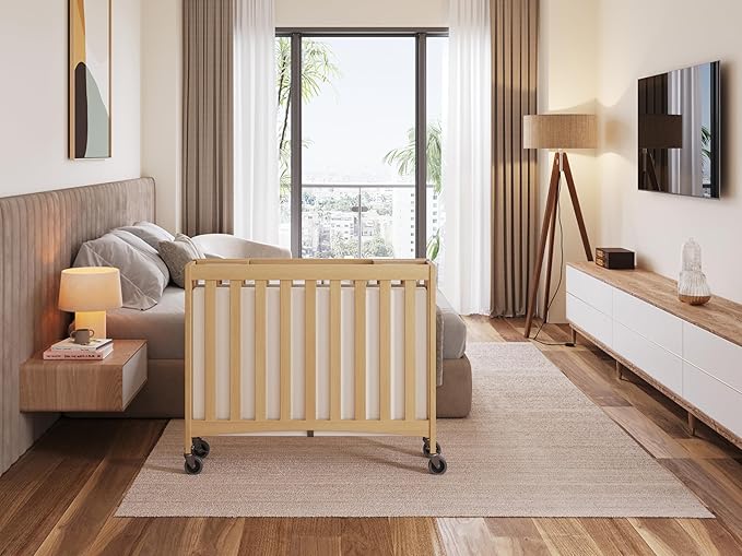 Foundations Travel Sleeper Wood Compact Folding Crib with 2” InfaPure Foam Crib Mattress and Commercial Grade Casters for Hotels, Natural