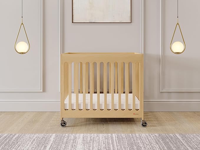 Foundations Boutique Folding Mini Baby Crib - Compact, Portable, Wooden Hotel Crib, Foldable Mini Crib for Baby & Toddlers - Includes 3" Foam Mattress, Natural