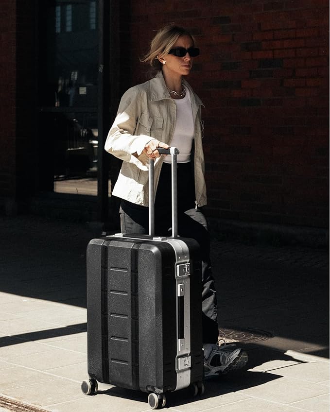 D_b_ Ramverk Pro Medium Check-In 25 Inch Hardside Luggage Extra Protection Aluminum Frame, Silent 360 Spinner Wheels, TSA Lock, Interior Laptop Compartment - Silver Frame/Black