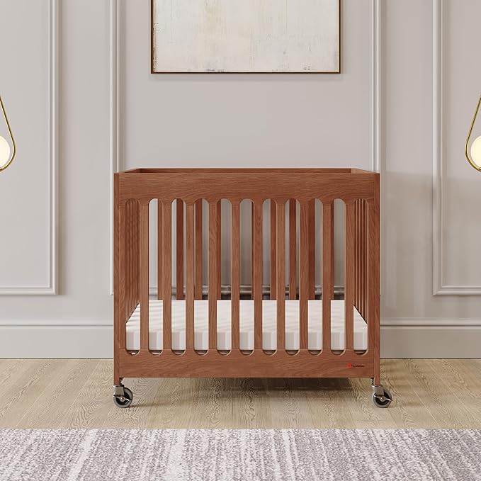 Foundations Boutique Folding Mini Baby Crib - Compact, Portable, Wooden Hotel Crib, Foldable Mini Crib for Baby & Toddlers - Includes 3" Foam Mattress, Cherry