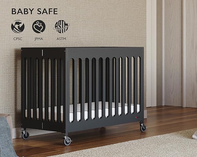 Foundations Boutique Folding Mini Baby Crib - Compact, Portable, Wooden Hotel Crib, Foldable Mini Crib for Baby & Toddlers - Includes 3" Foam Mattress, Ebony