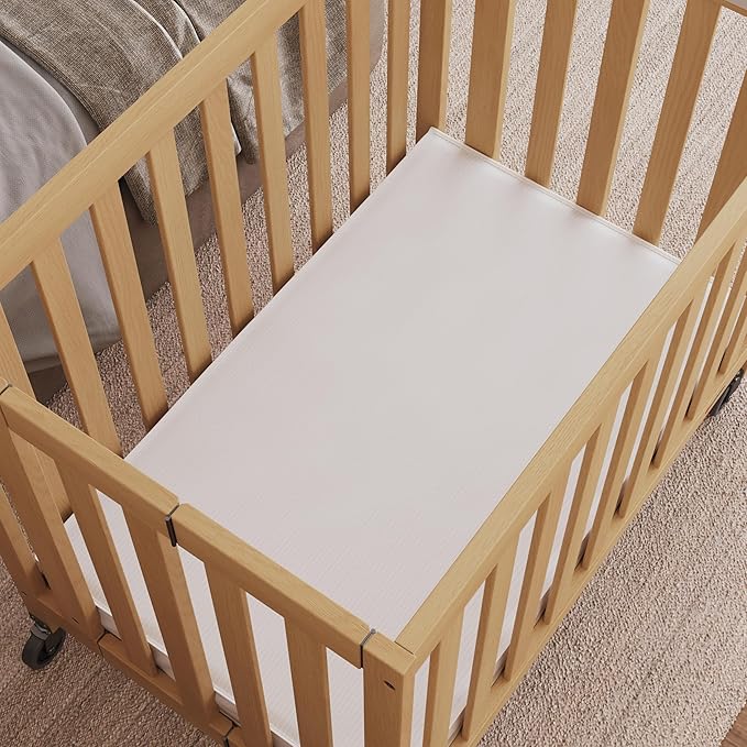 Foundations Travel Sleeper Wood Compact Folding Crib with 2” InfaPure Foam Crib Mattress and Commercial Grade Casters for Hotels, Natural
